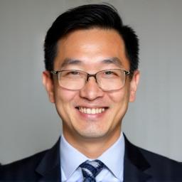 Professional headshot of Marcus Chen.